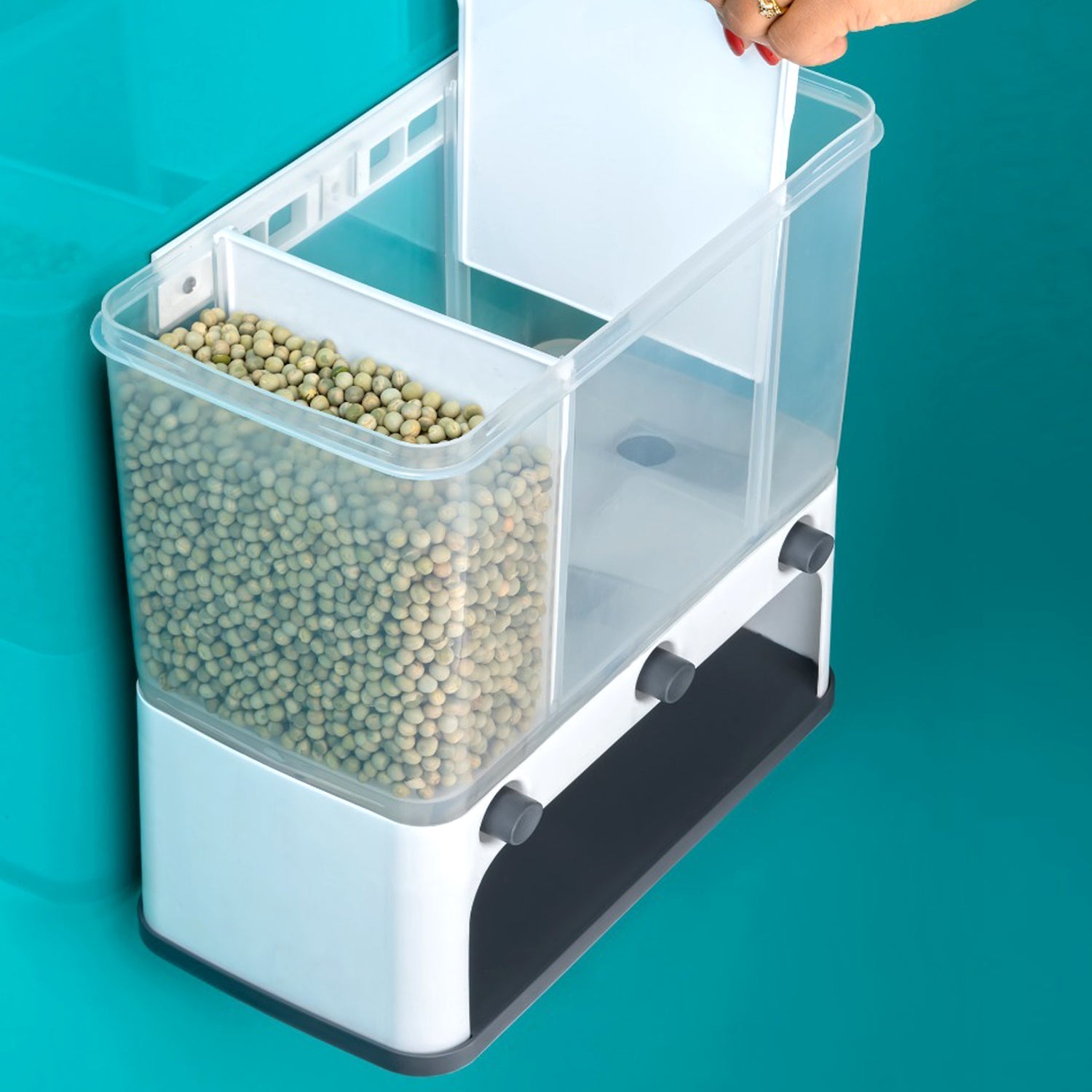 Wall-mounted cereal dispenser in use Wall-mounted cereal dispenser in use